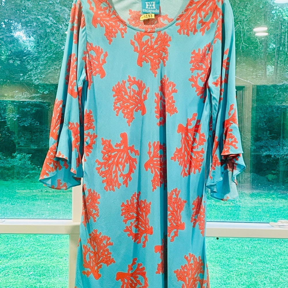 Escapada bright aqua with coral color 3/4 ruffled sleeves.  Excellent condition.